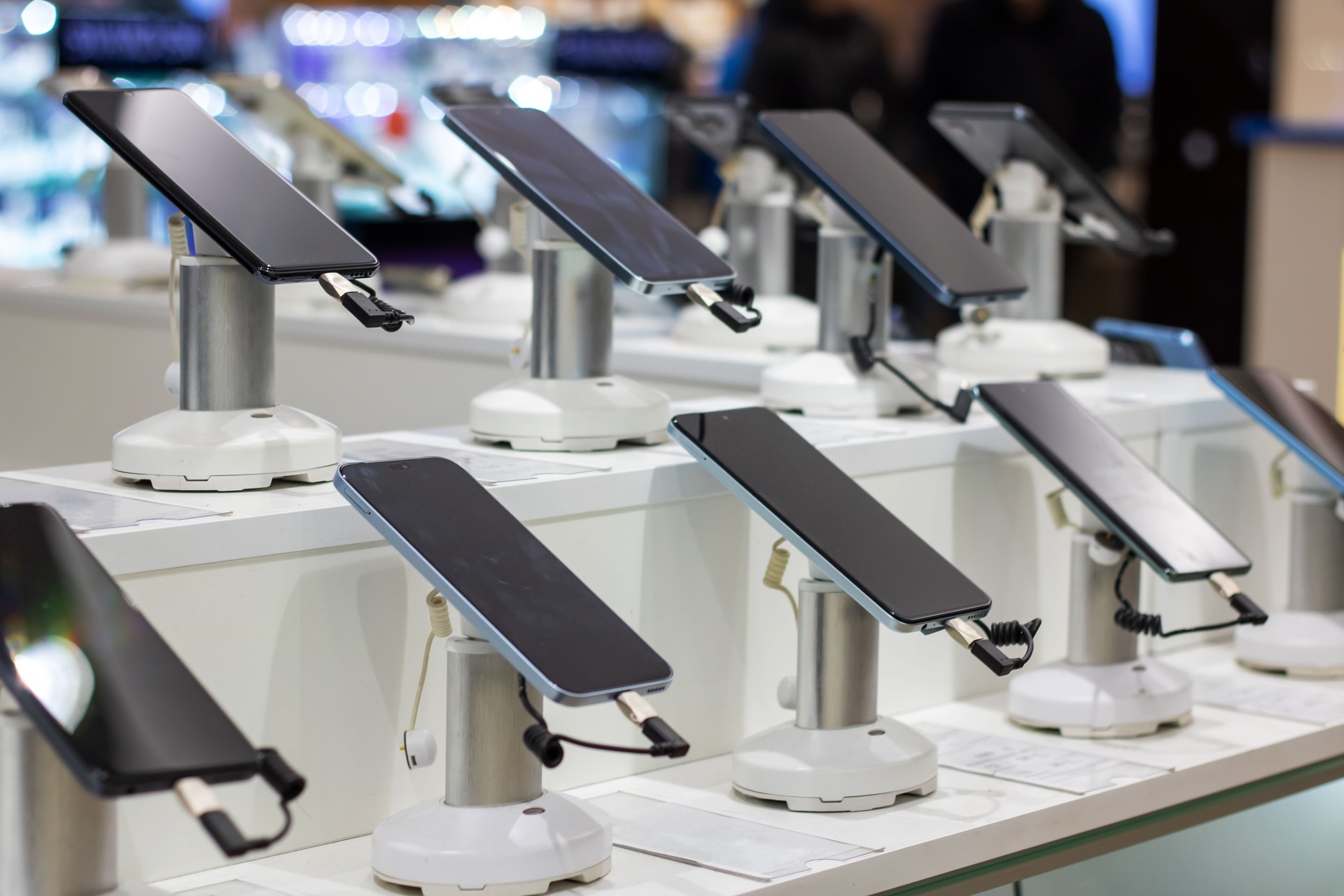 A row of mobile phones in a shop window